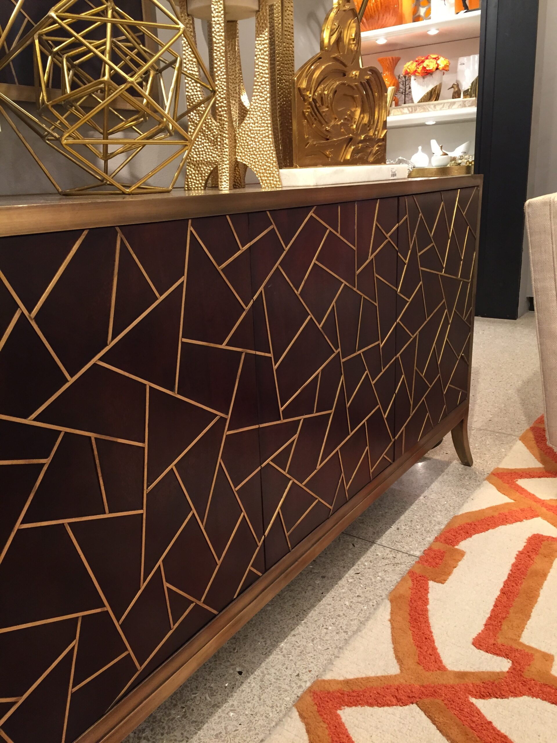 This tangier media cabinet from Global Views is a show stopper! The magnificent metal inlay on the doors is gorgeous. Paired with the geometric rug is fantastic!