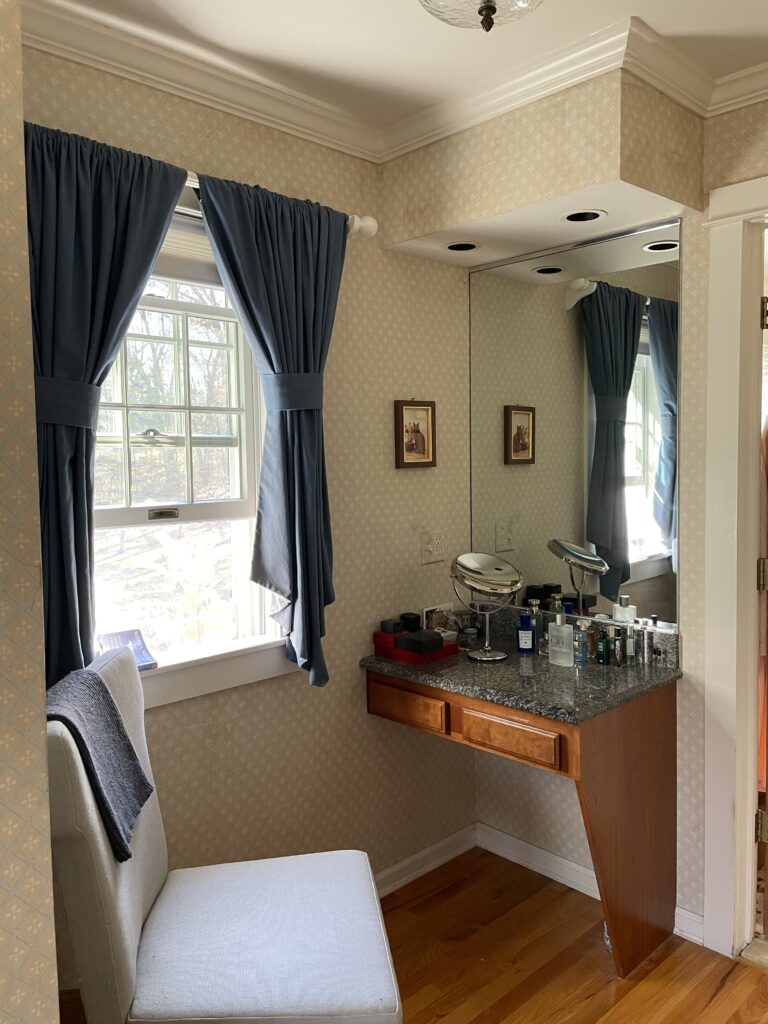 Before view of a primary bedroom showing natural light, empty walls, and an unlayered layout.