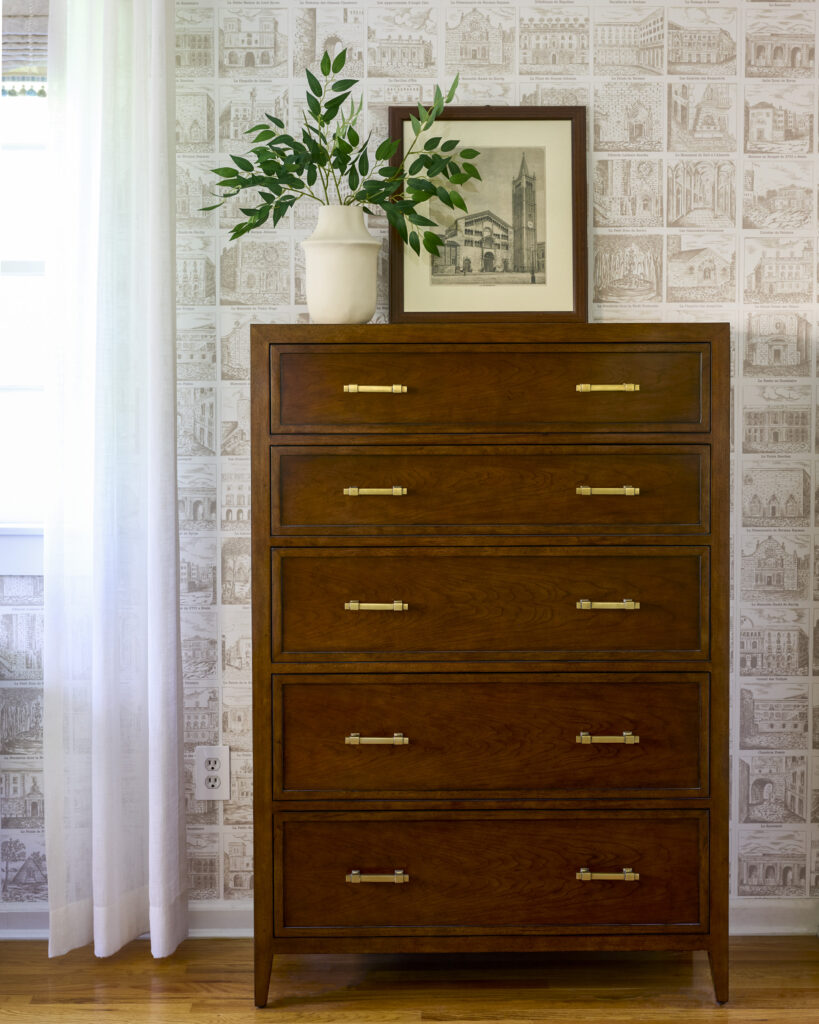 After view of a finished primary bedroom showcasing a timeless primary bedroom design with layered textures, classic furniture, and a calm, cohesive layout.