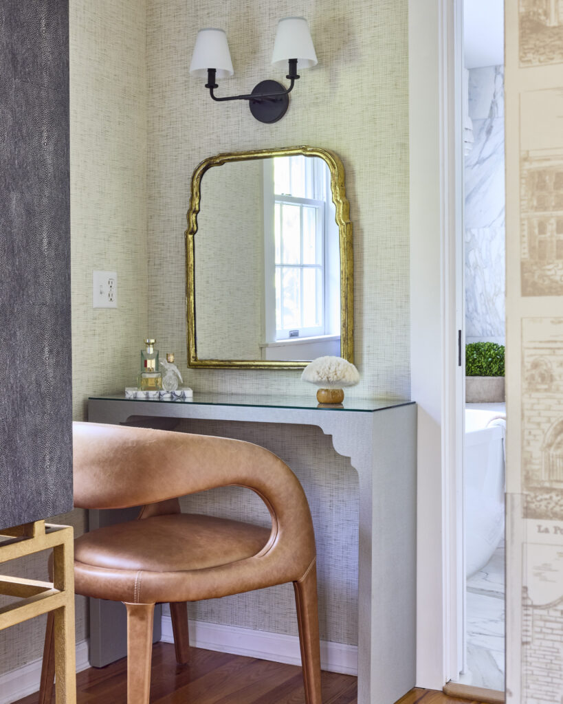 After view of a finished primary bedroom showcasing a timeless primary bedroom design with layered textures, classic furniture, and a calm, cohesive layout.
