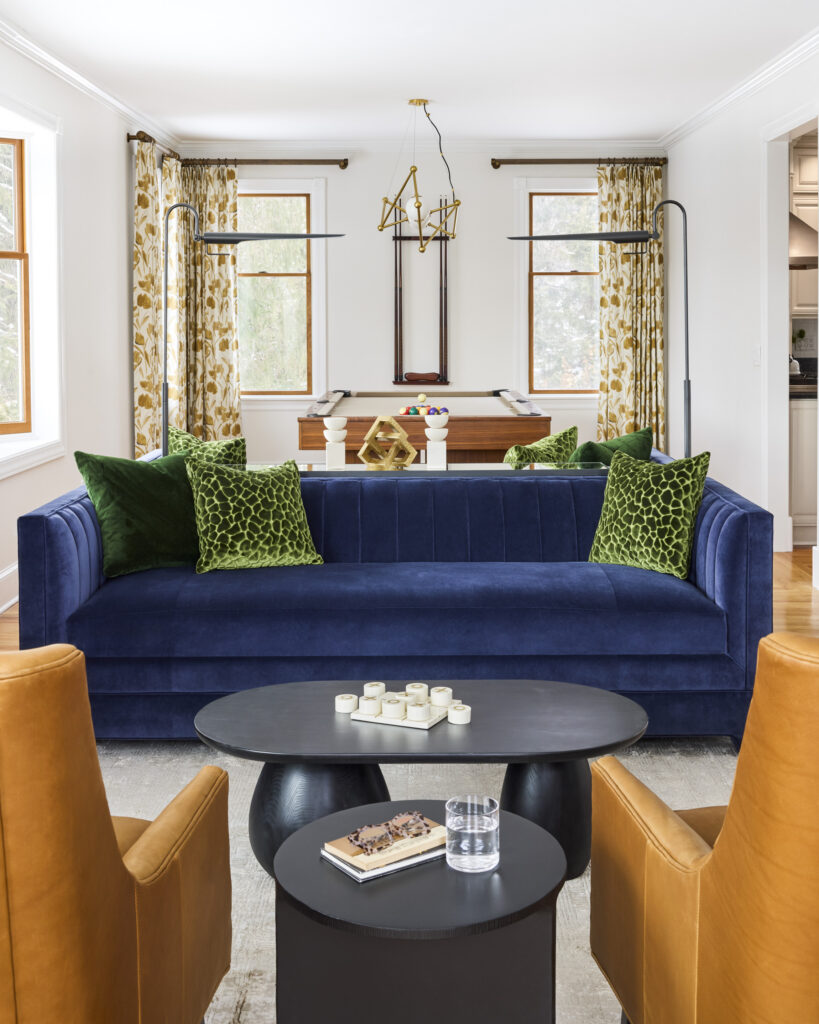 A full home transformation starting with the perfect sofa. Explore this living room, game room, and foyer design for a cohesive, elevated space.